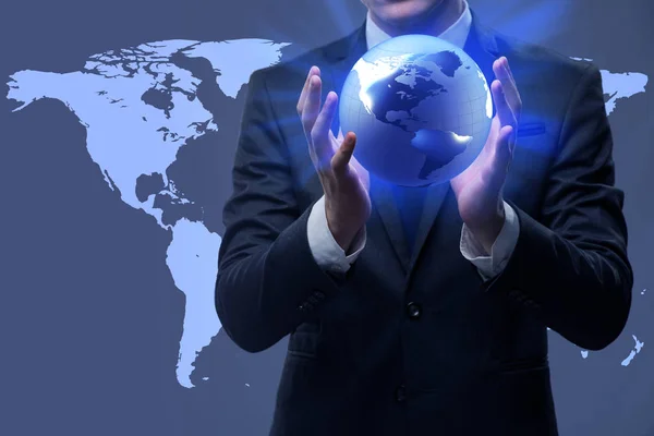 Businessman holding globe in global business concept — Stock Photo, Image