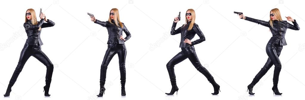 Woman in leather costume with gun isolated on white