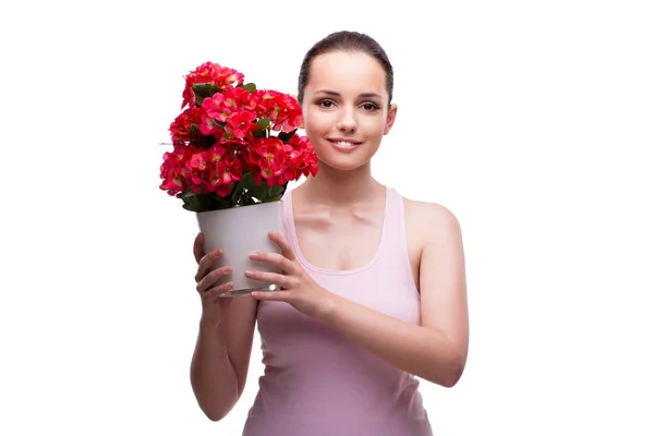 Frau mit Topf voller roter Blumen auf weißem Grund — Stockfoto