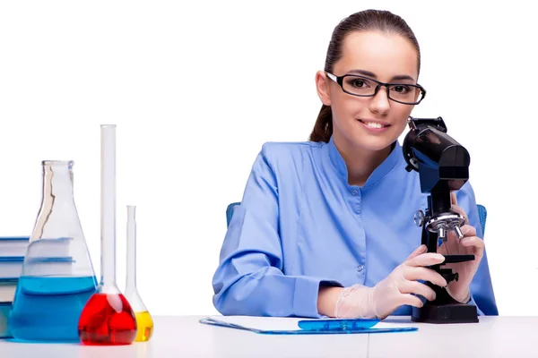 Lab chemist working with microscope and tubes Royalty Free Stock Images