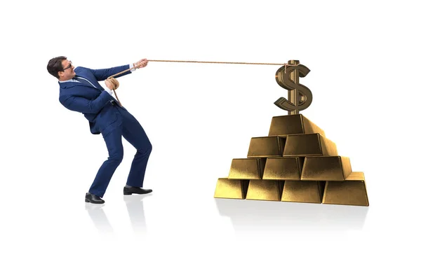 Empresario tirando de dólares y lingotes de oro —  Fotos de Stock
