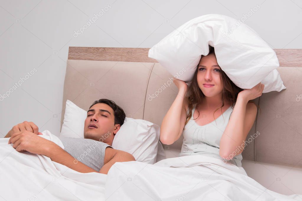 Woman having trouble with husband snoring