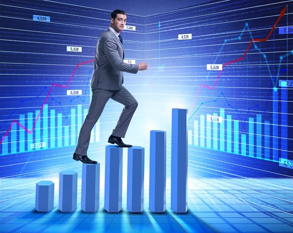 Zakenman klimmen bar grafieken in business concept — Stockfoto