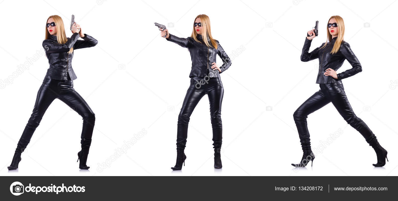 Woman in leather costume with gun isolated on white — Stock Photo