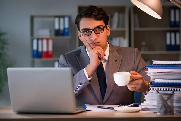 Businessman staying in the office for long hours — Stock Photo, Image