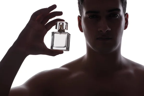 Sexy man with bottle of perfume — Stock Photo, Image