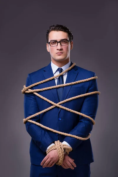 Empresario atado con cuerda — Foto de Stock