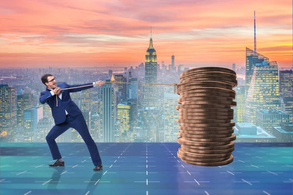 Businessman pulling stack of gold coins — Stock Photo, Image