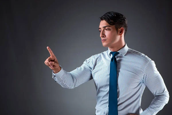 Hombre de negocios guapo presionando botones virtuales —  Fotos de Stock