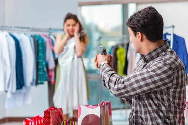 Man fed up with wife shopping in shop