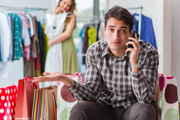 Man fed up with wife shopping in shop