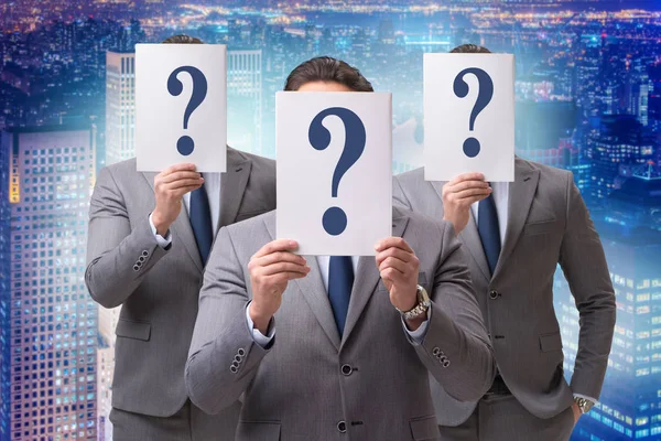 Businessman in uncertainty concept with question marks — Stock Photo, Image