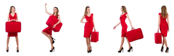 Jeune femme en robe rouge avec valise isolée sur blanc — Photo