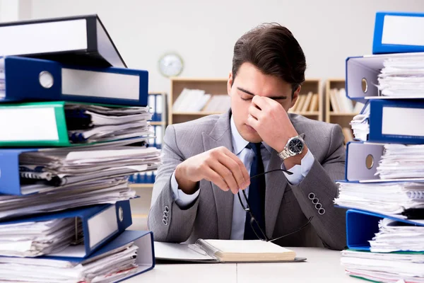 Busy businessman under stress due to excessive work Royalty Free Stock Photos