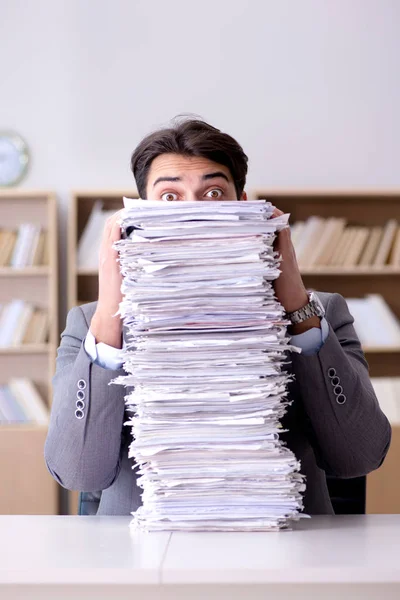 Businessman struggling to meet challenging deadlines