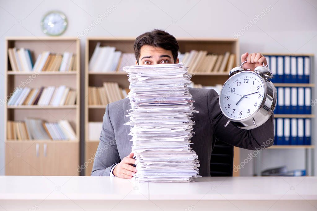 Businessman struggling to meet challenging deadlines