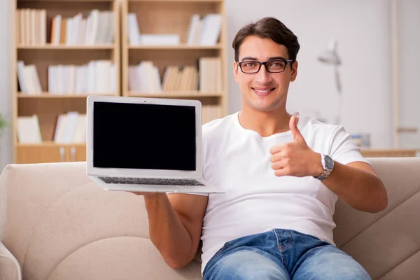 Man working sitting in couch sofa — Stock Photo, Image