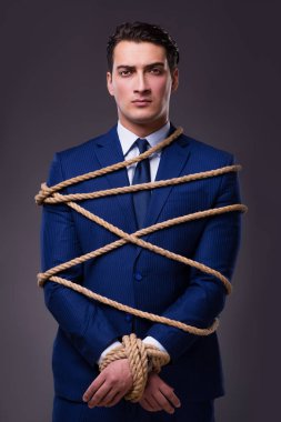 Businessman tied up with rope clipart
