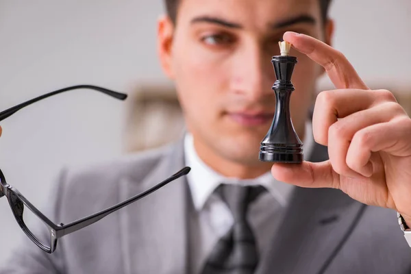 Young businessman playing chess in the office — Stock Photo, Image
