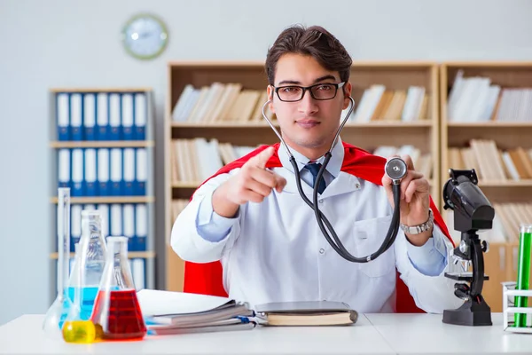 Superhero doctor working in the hospital lab