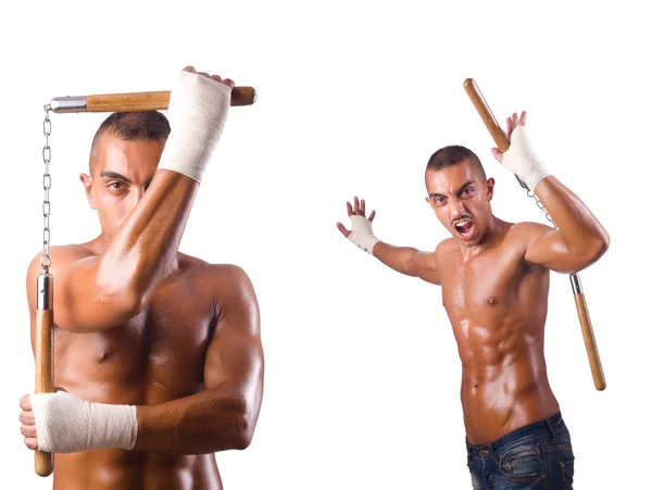 Guerriero di arti marziali con nunchaku su bianco — Foto Stock