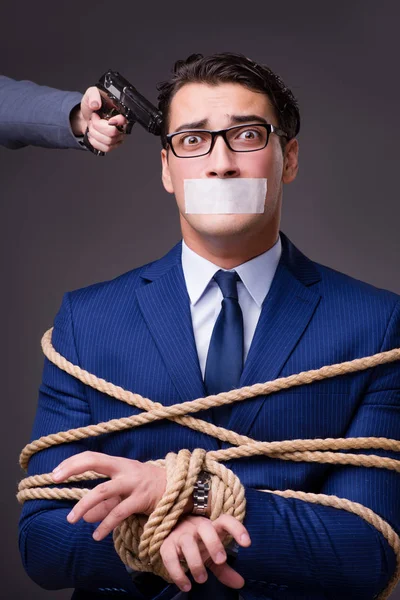 Businessman taken hostage and tied up with rope — Stock Photo, Image