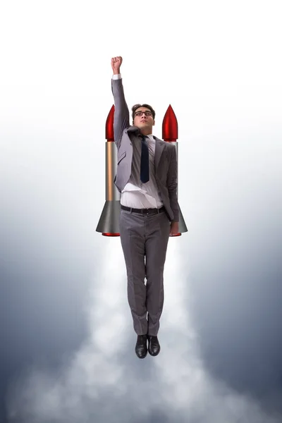 Man flying with the rocket in business concept