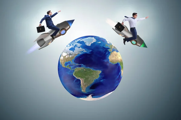 Two businessmen chasing around globe — Stock Photo, Image