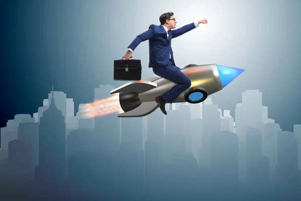 Businessman flying on rocket in business concept — Stock Photo, Image