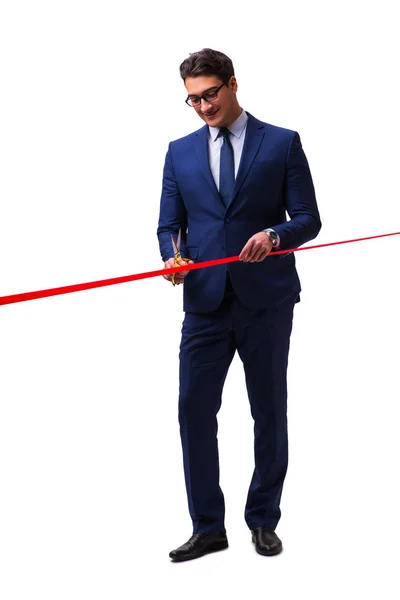 Businessman cutting red ribbon isolated on white — Stock Photo, Image