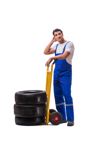 Reparador de neumáticos con carro aislado en blanco —  Fotos de Stock