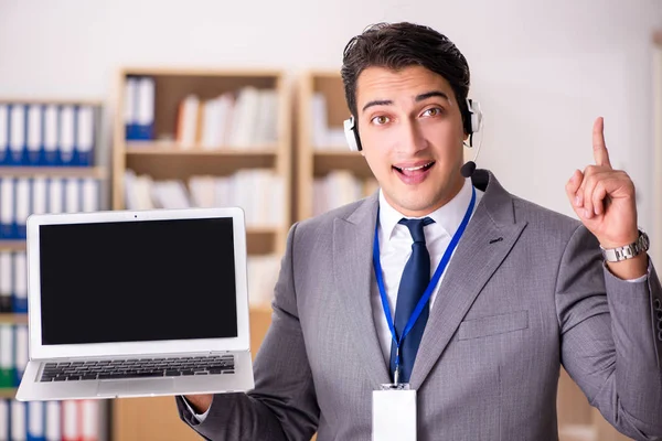 Handsome customer service clerk with headset — Stock Photo, Image