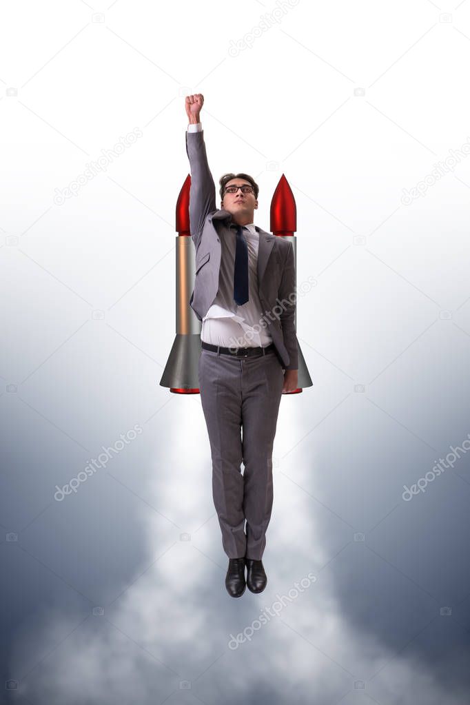 Man flying with the rocket in business concept