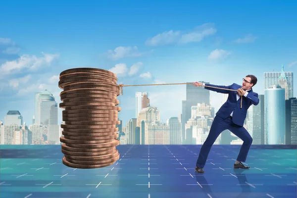 Businessman pulling stack of gold coins — Stock Photo, Image