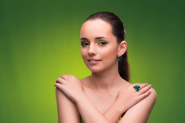 Young woman in beauty concept on green background — Stock Photo, Image