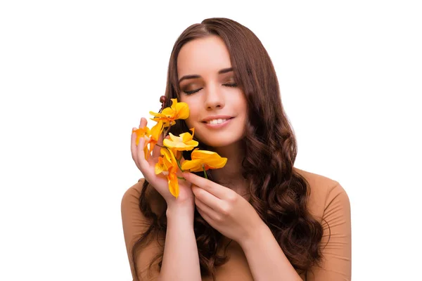 Vacker kvinna med orkidé blomma isolerad på vit — Stockfoto