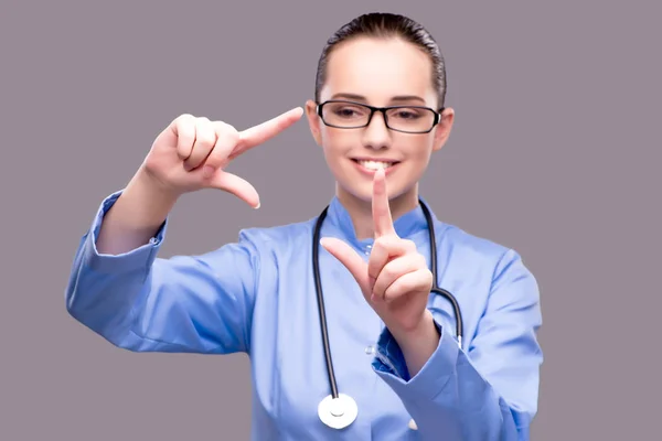 Young doctor pressing virtual button — Stock Photo, Image