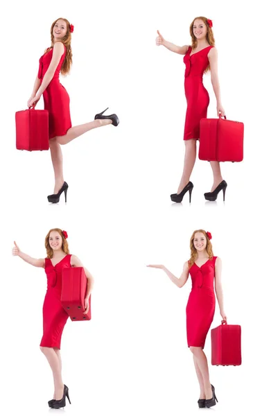 Jeune femme en robe rouge avec valise isolée sur blanc — Photo