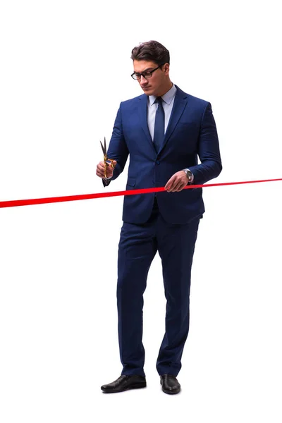 Businessman cutting red ribbon isolated on white — Stock Photo, Image