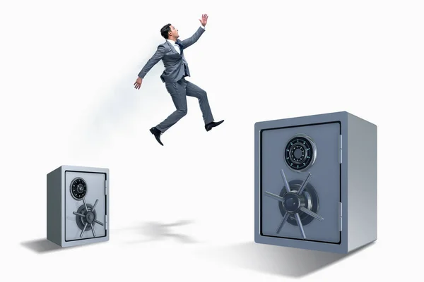 Affärsman hoppar från kassaskåp i affärsidé — Stockfoto