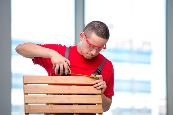 Young furniture carpenter in industrial concept — Stock Photo, Image