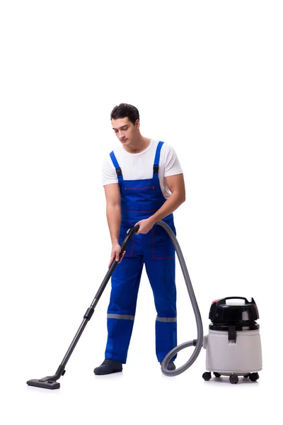 Man in coveralls doing vacuum cleaning on white — Stock Photo, Image