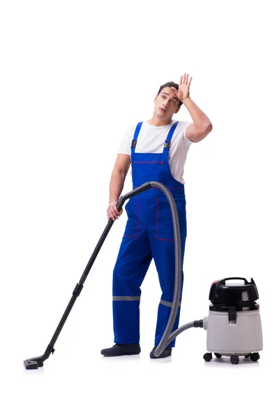 Man in overall doen vacuüm reiniging op wit — Stockfoto