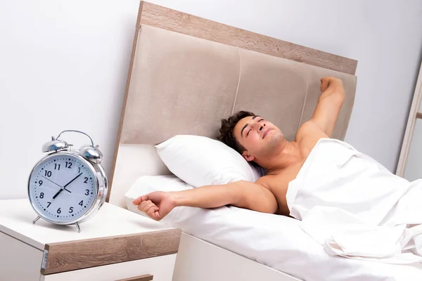 Young man having trouble waking up in the morning — Stock Photo, Image