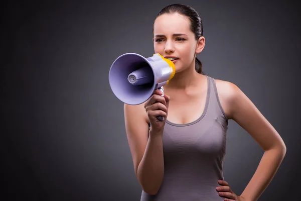 Woman in sports concept with loudspeaker — Stock Photo, Image