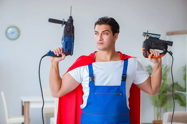 Super hero repairman working at home — Stock Photo, Image