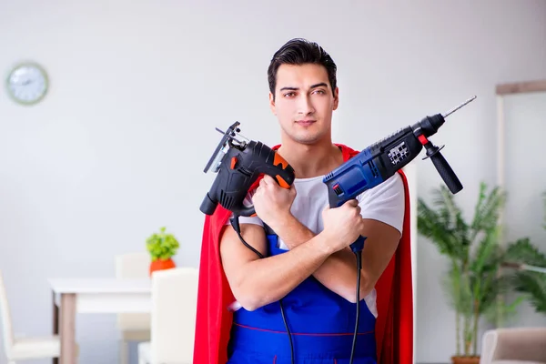 Superhero repairman with tools in repair concept — Stock Photo, Image