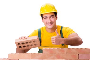 Tuğla duvar inşa yakışıklı inşaat işçisi