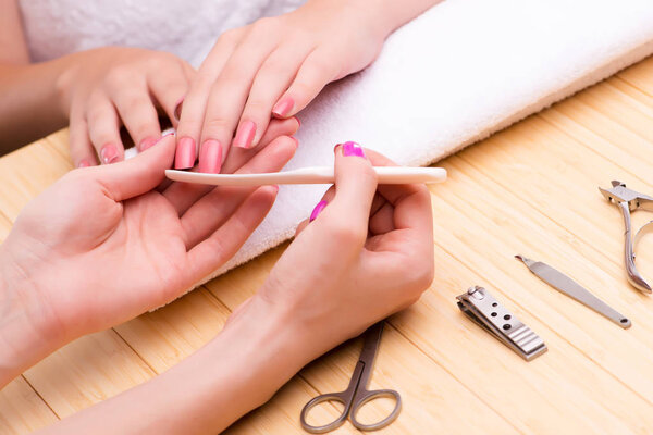 Woman hands during manicure session