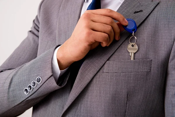 Businessman in real estate concept with home key — Stock Photo, Image